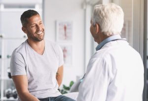 white man talking with doctor. Demonstrating what happens after your prostate cancer treatment